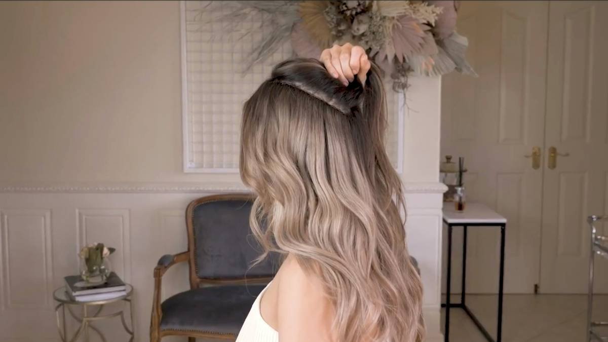 Close-up of blonde balayage hair showing faded roots and brassy ends requiring a balayage hair refresh